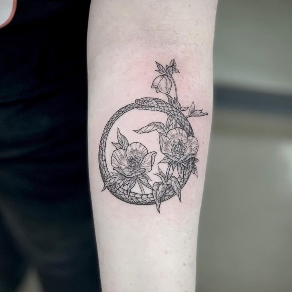 Floral Ouroboros Tattoo with Botanical Detail Tattoo Design