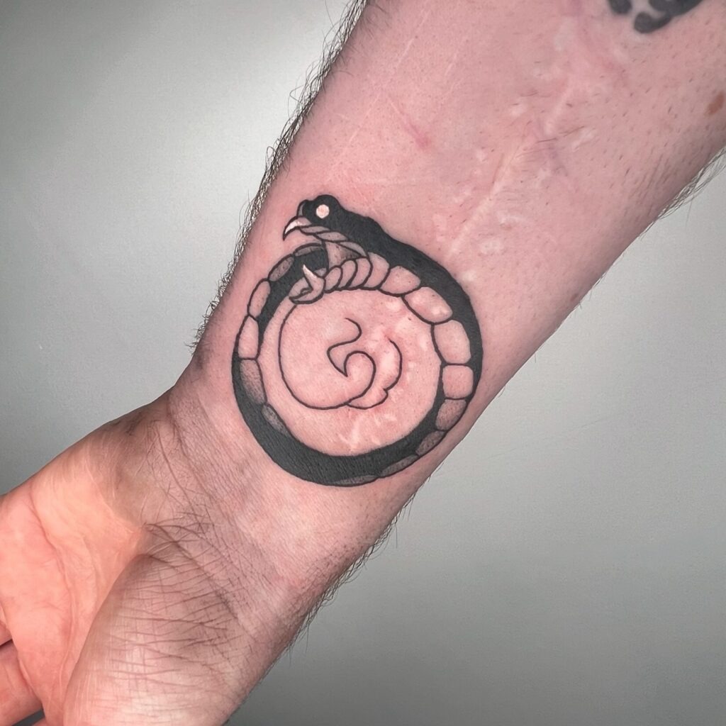 Spiral Ouroboros Wrist Tattoo Tattoo Design