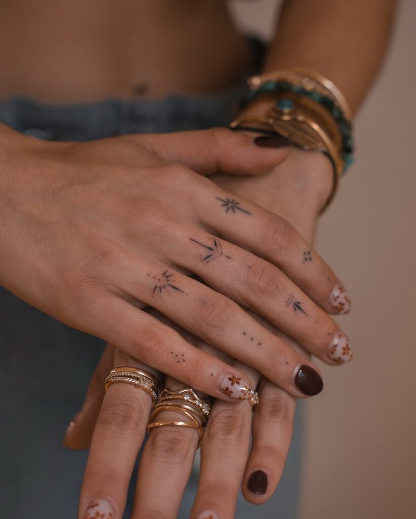 Minimal Starburst and Dot Finger Stick and Poke Tattoos Tattoo Design
