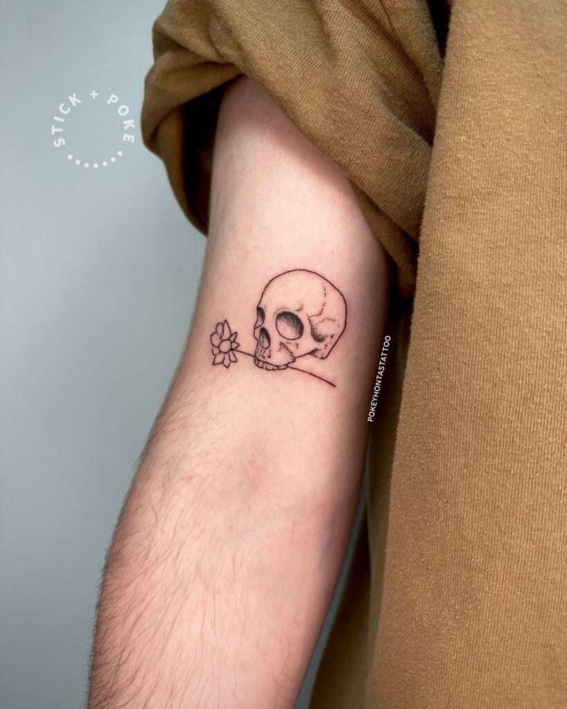 Skull with Flower Stick and Poke Tattoo Tattoo Design