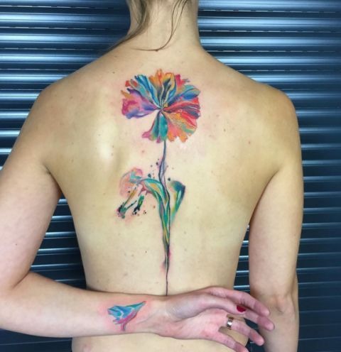 The design centers on elegant floral backpiece imagery that reads clearly at a glance.