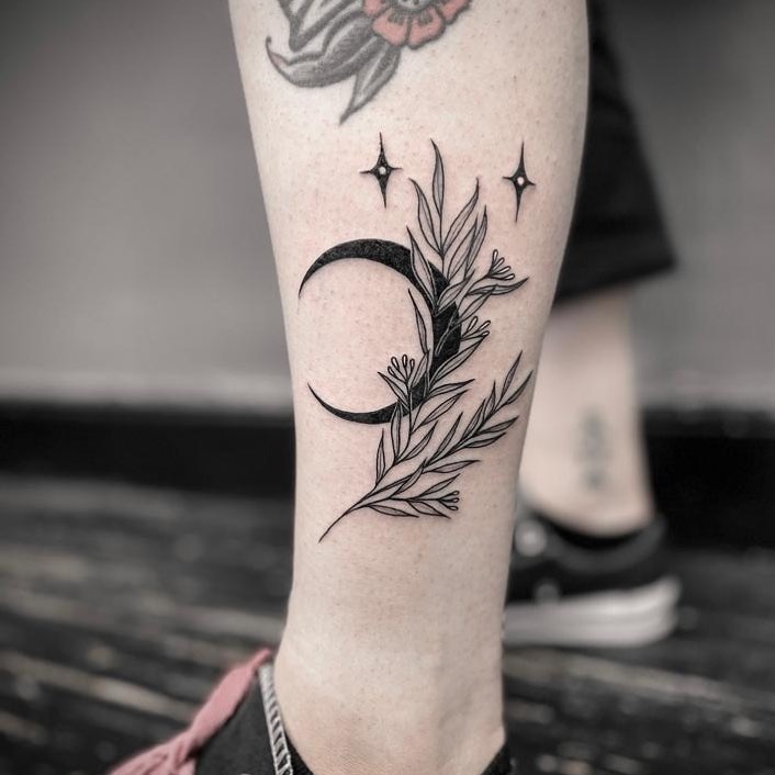 A delicate blend of moon and floral elements Tattoo Design
