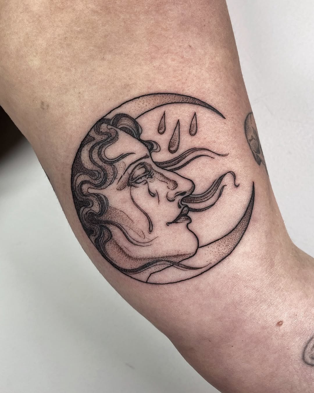 Artistic crescent moon with emotive features Tattoo Design