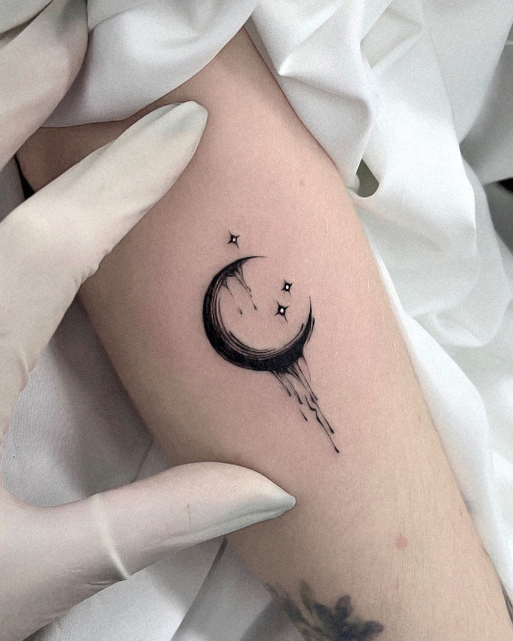 Delicate Crescent Moon with Whimsical Stars Tattoo Design