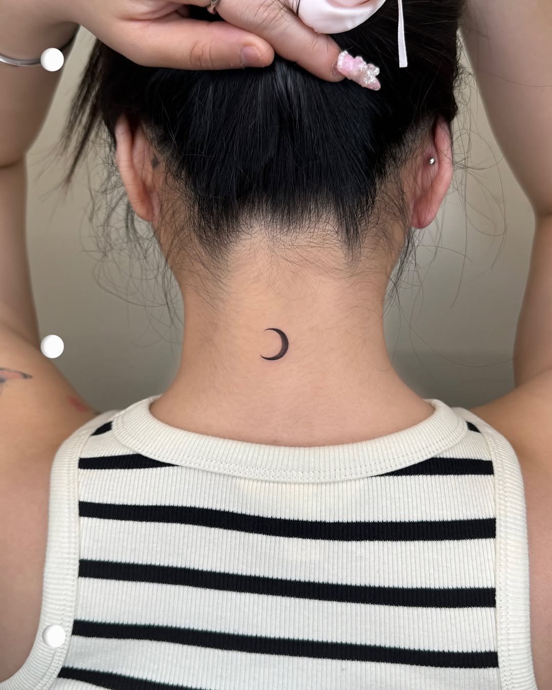 Elegant crescent moon tattoo on the neck Tattoo Design