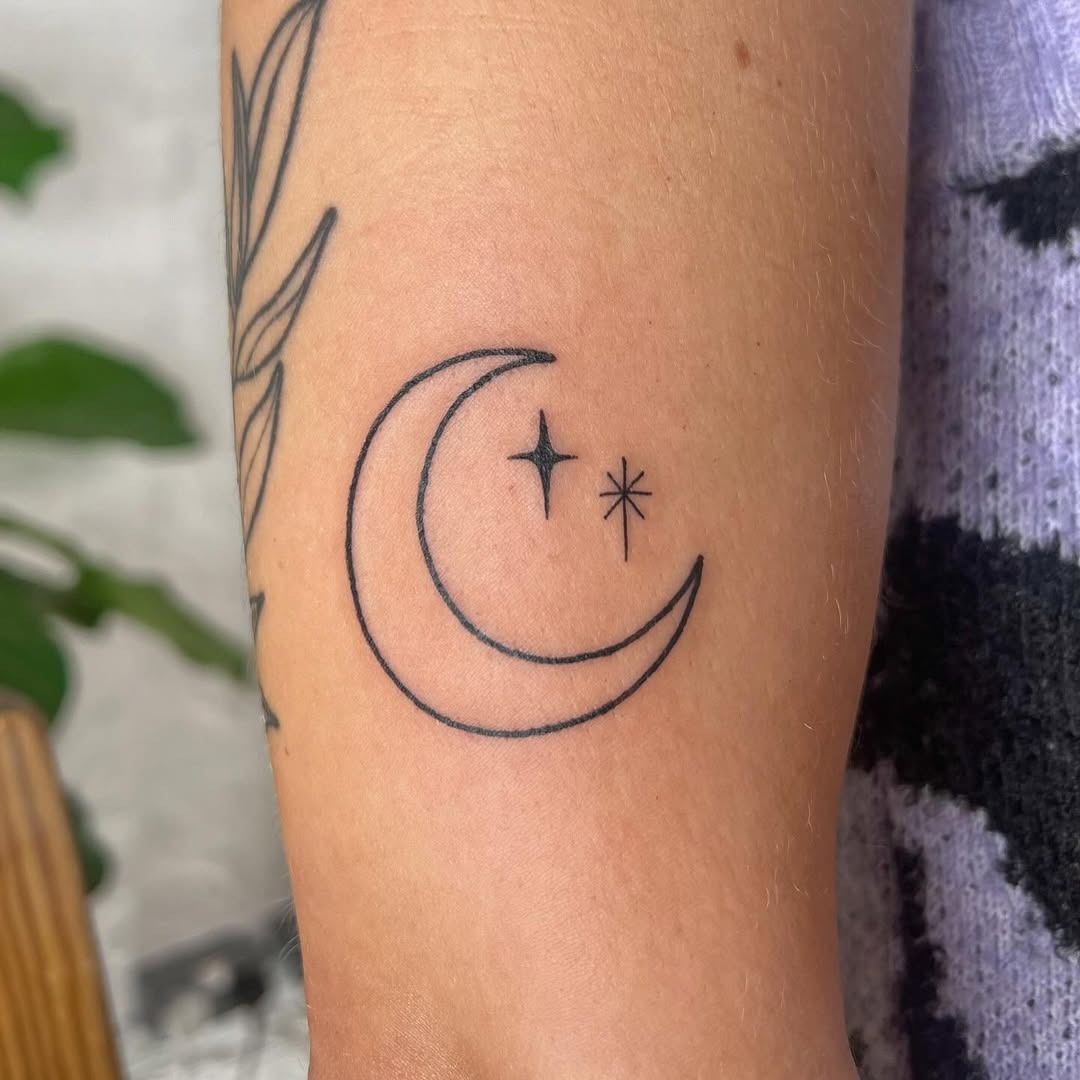 Elegant crescent moon with twinkling stars Tattoo Design