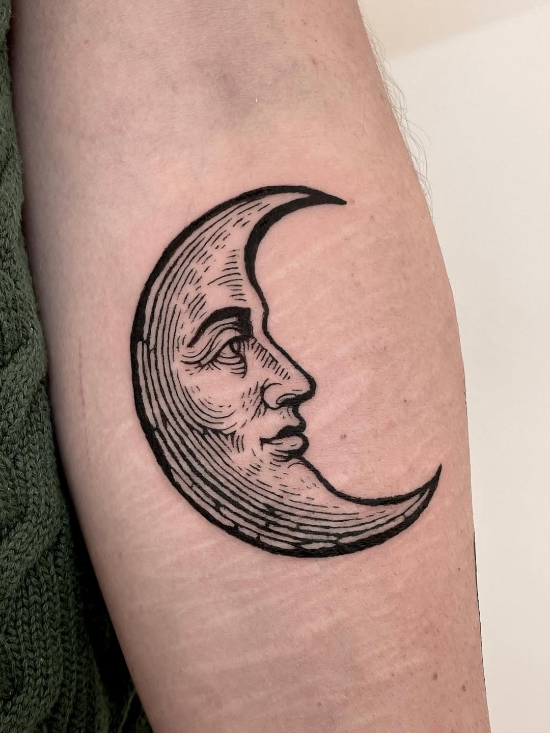 Intricate Crescent Moon Tattoo with Hybrid Face Tattoo Design