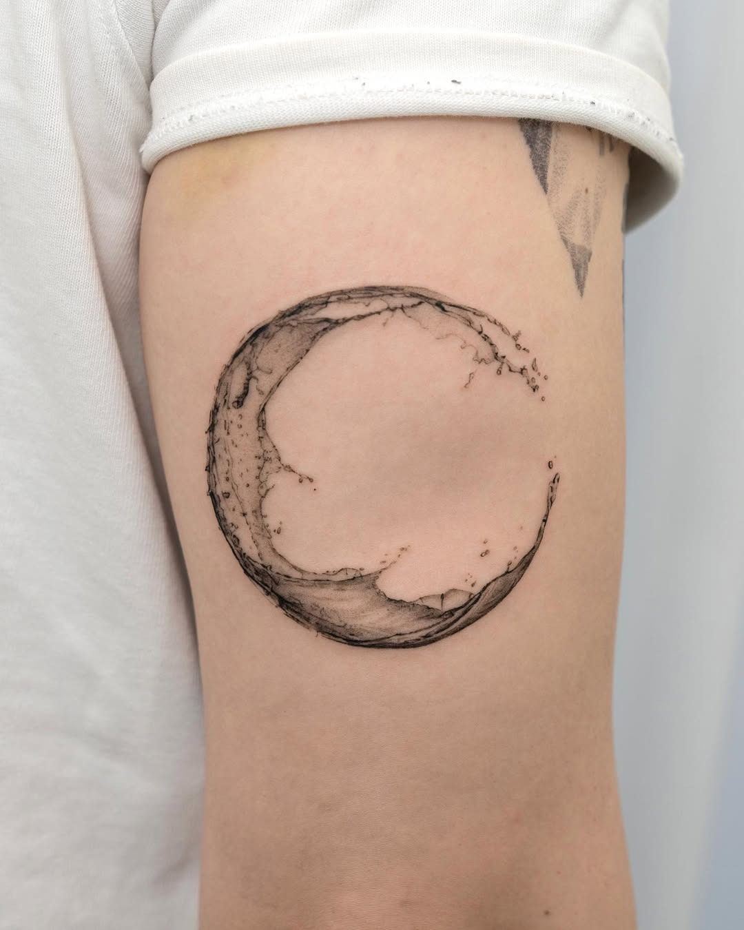 Minimalistic crescent moon tattoo on arm Tattoo Design