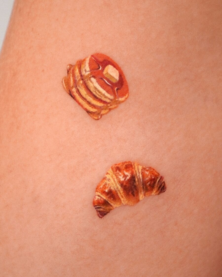 These tattoos feature adorable, realistic croissants and pastries.