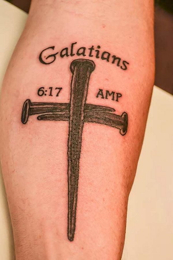 Cool cross tattoo on a guy’s arm Tattoo Design