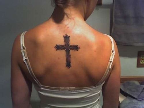 Cute cross tattoo on a girls back Tattoo Design