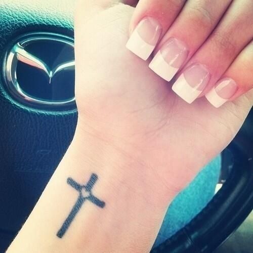 Cute cross tattoo on girl’s wrist Tattoo Design