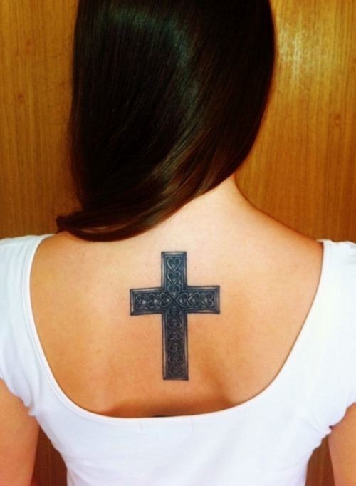 Sexy black cross tattoo on a girl’s back Tattoo Design