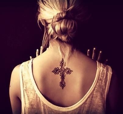 Sexy black tattoo on a girl’s back Tattoo Design