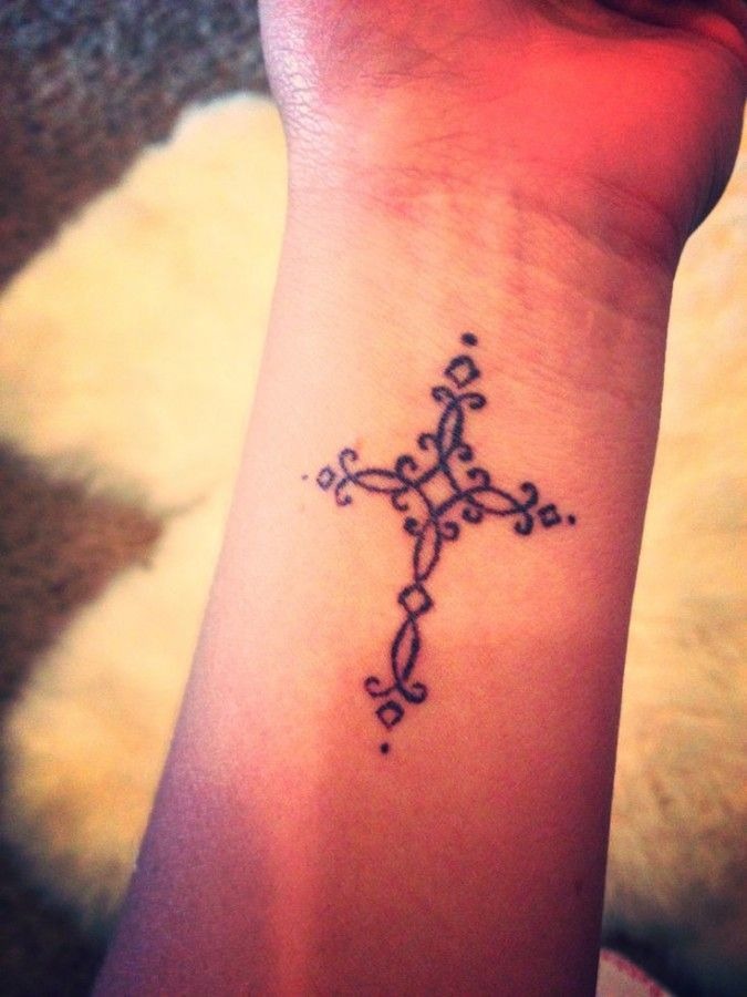 Sexy cross tattoo on a girls arm Tattoo Design