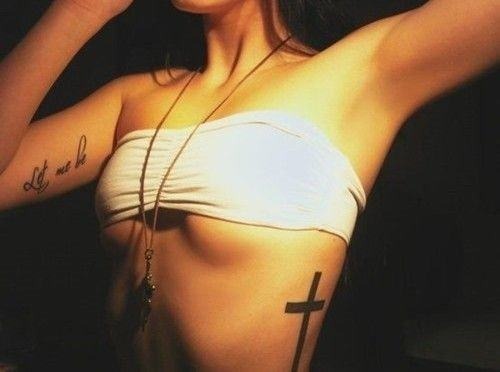Sexy cross tattoo on girl’s side Tattoo Design
