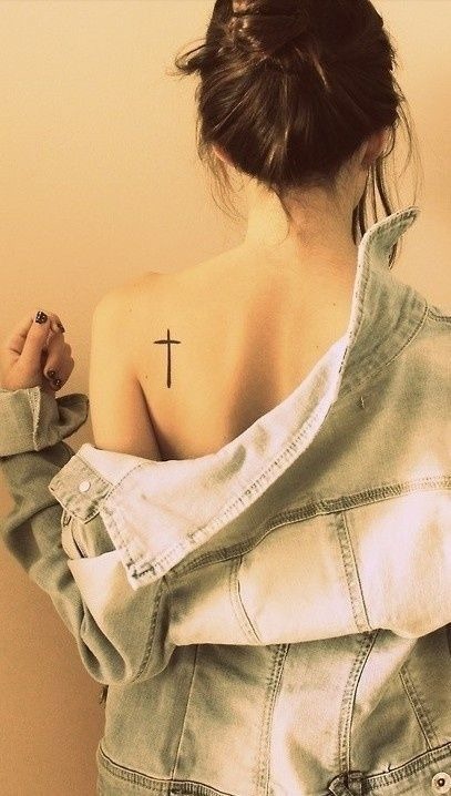 Simple black tattoo on a girl’s shoulder blade Tattoo Design