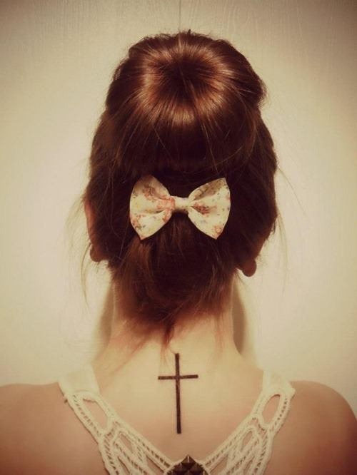 Simple cross tattoo on girl’s neck Tattoo Design