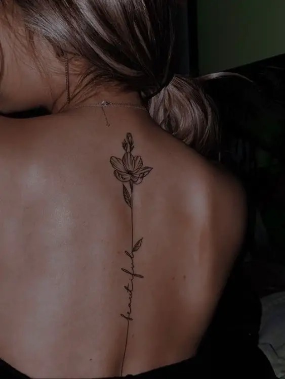 Elegant Script with Lotus Tattoo Design