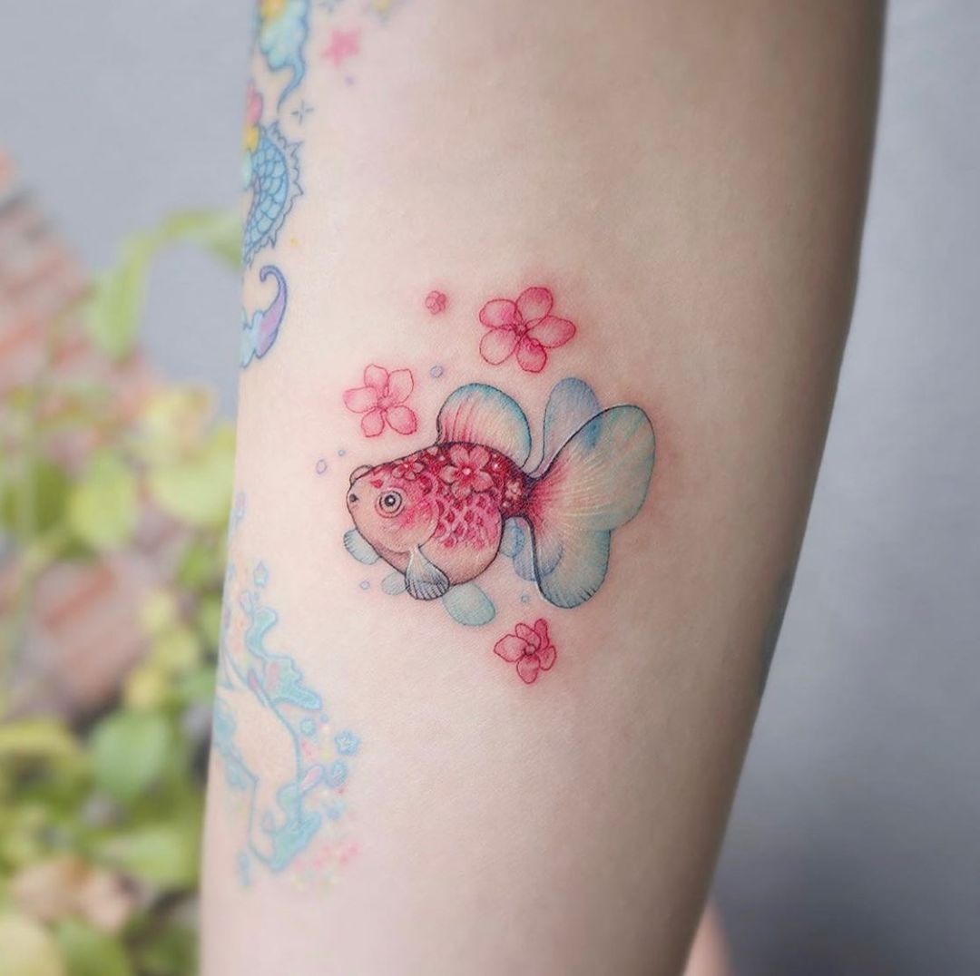 Delicate and Playful Fish Tattoo Tattoo Design