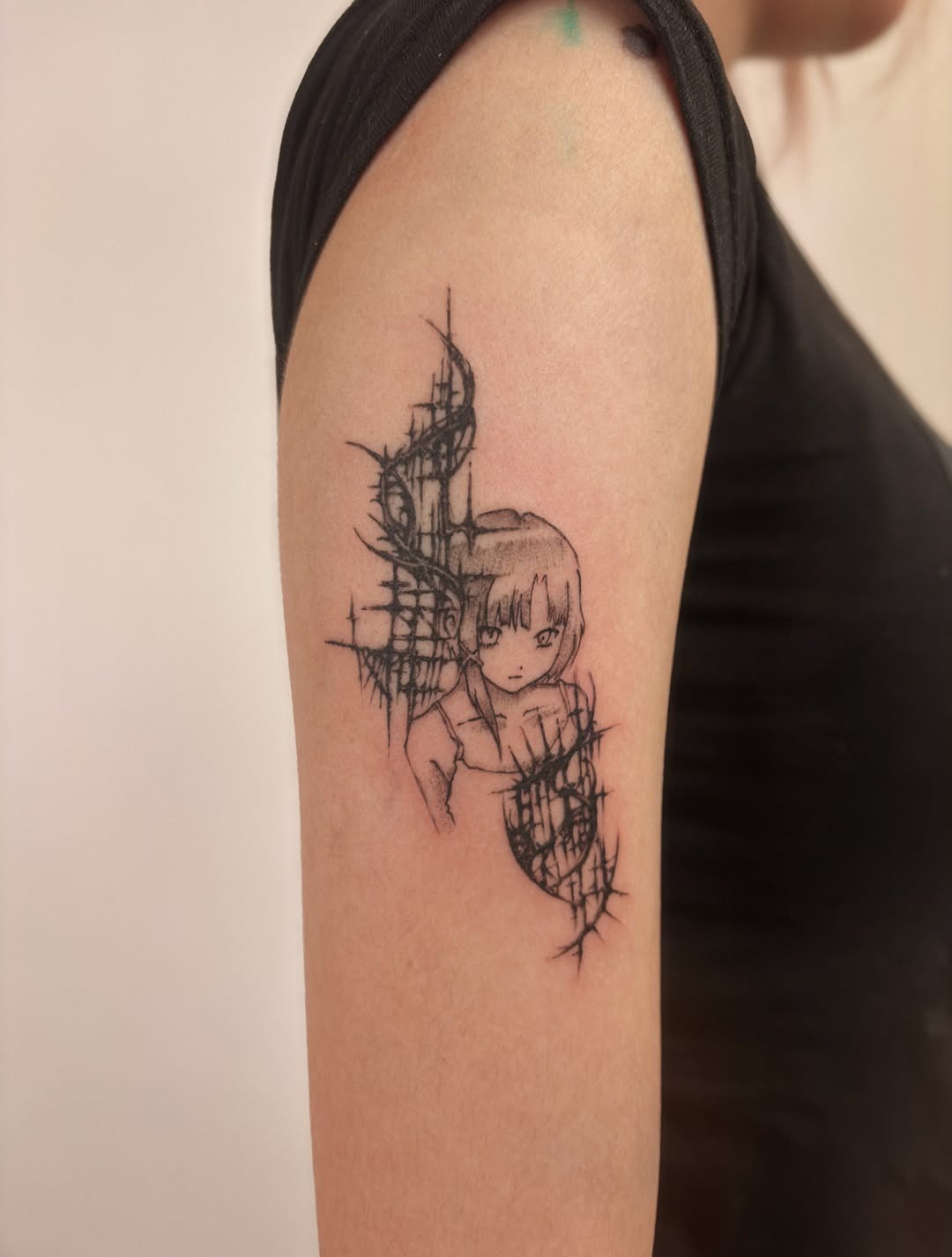 Fine line anime girl tattoo nestled within pointed cybersigilism thorn frames