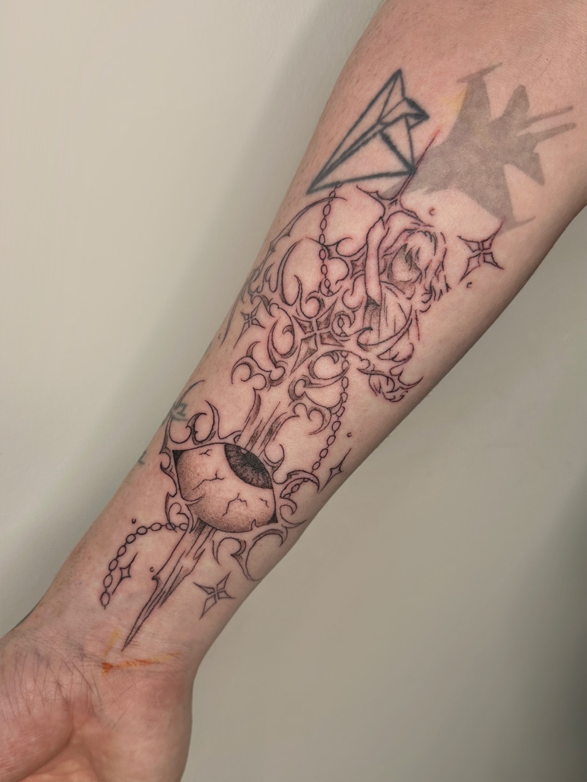 Cybersigilism eye and dark rose tattoo with fine line eyelashes and barbed thorns
