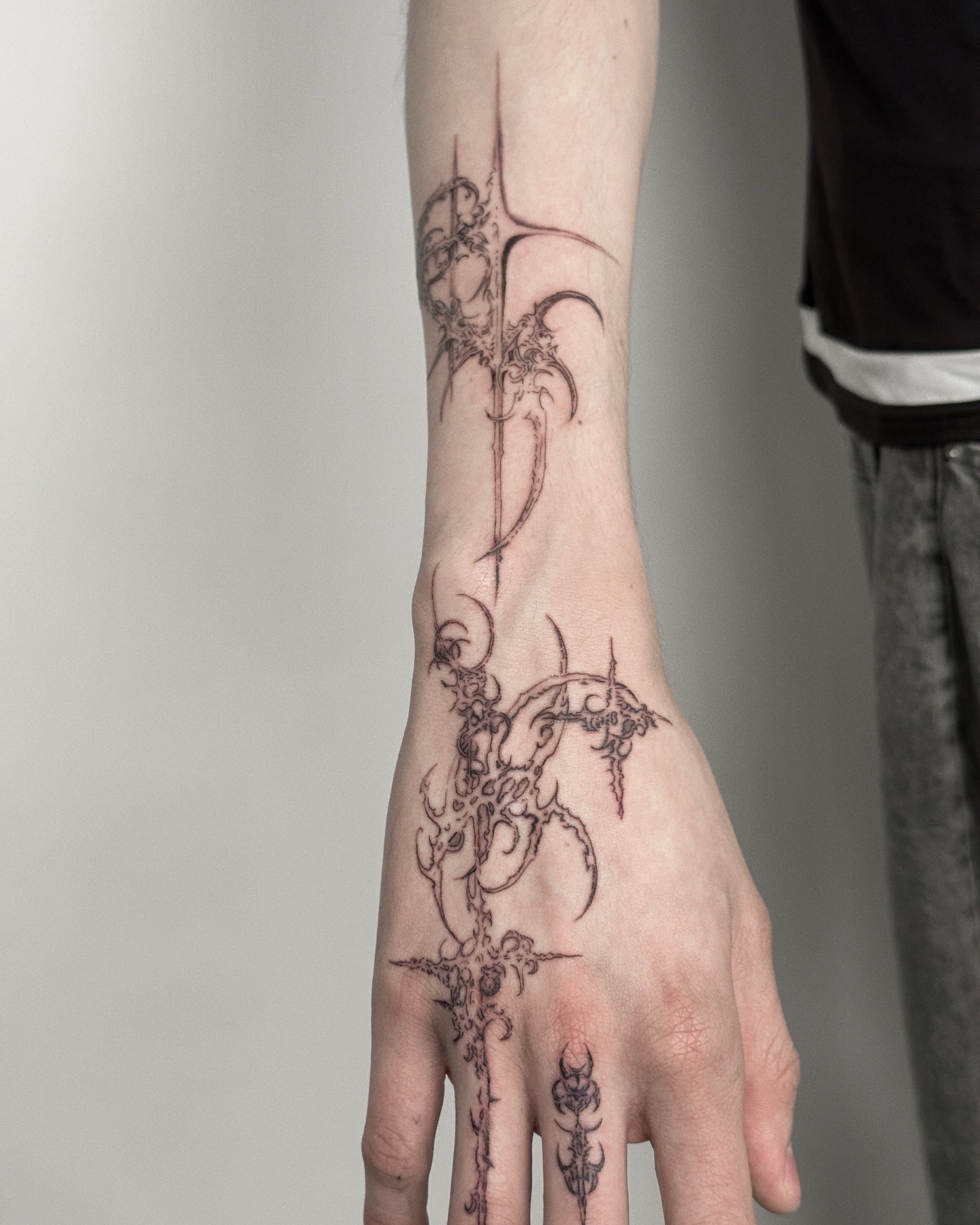 Gothic demon mask tattoo with stylized cybernetic horns and razor sharp jawlines