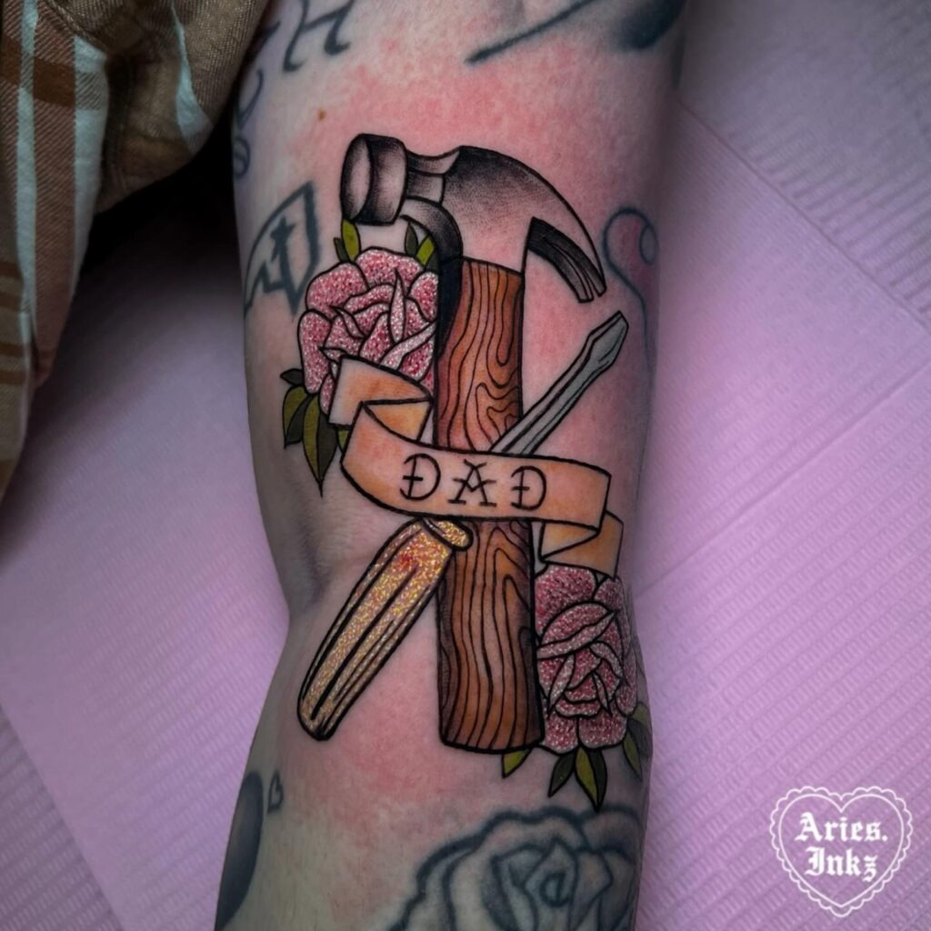 Memorial Cross Tattoo with Lily and “Dad” Banner Tattoo Design