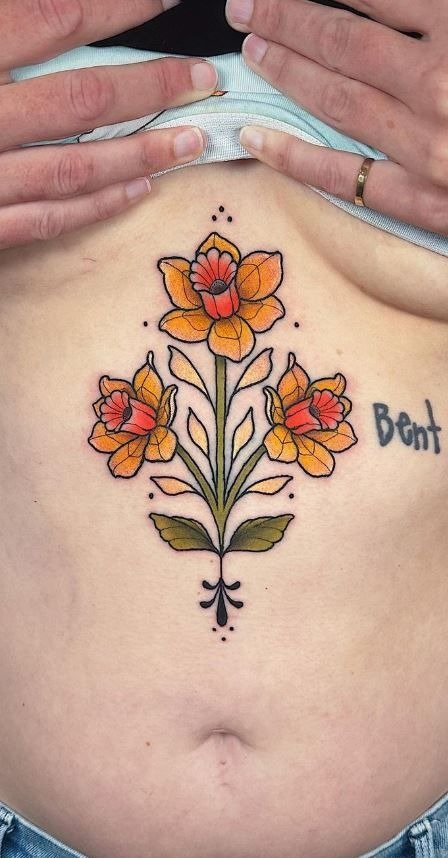 Bold Folk-Inspired Daffodil Trio Tattoo Design