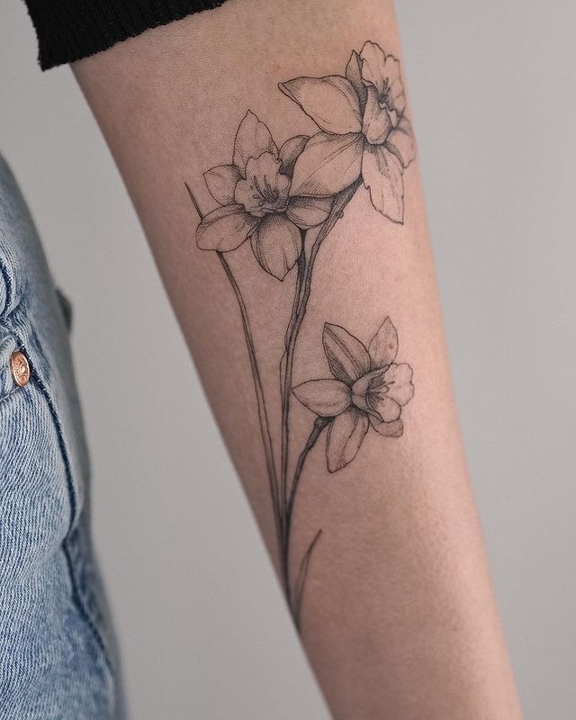Minimal Black and Gray Daffodil Trio Tattoo Design