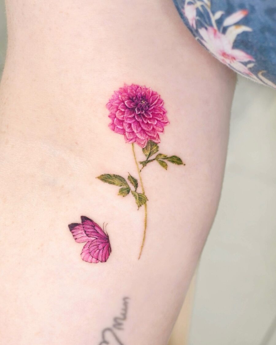This dahlia tattoo radiates beauty with its rich pink hues and intricate detailing.