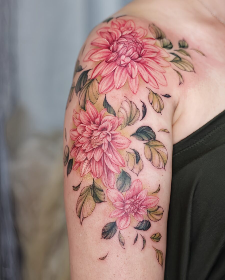 This stunning dahlia tattoo showcases intricate petals in pink hues.