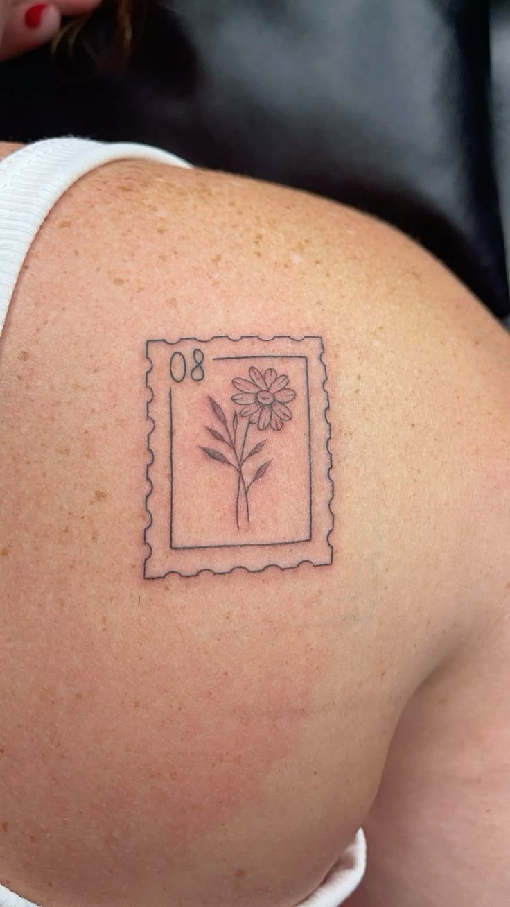 Tiny Daisy Stamp Tattoo Design