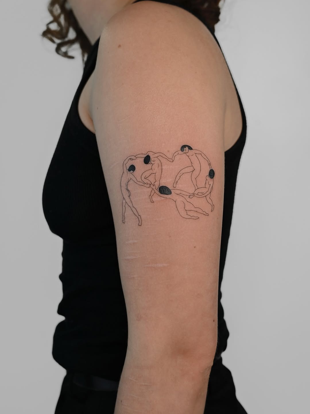 Dynamic figures intertwined in flowing motion Tattoo Design