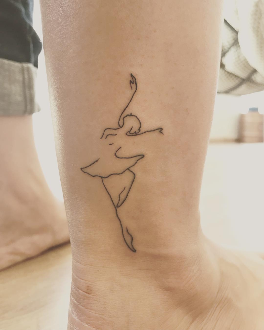 Elegant ballet dancer tattoo in clean lines Tattoo Design