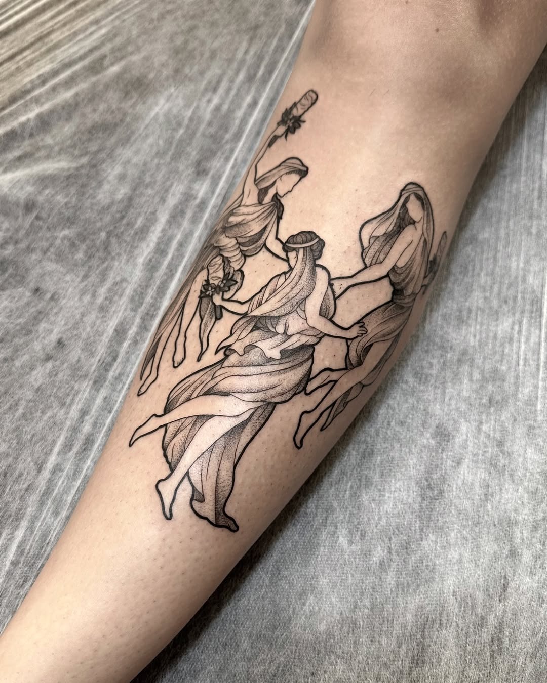 Graceful dance figures in flowing designs Tattoo Design