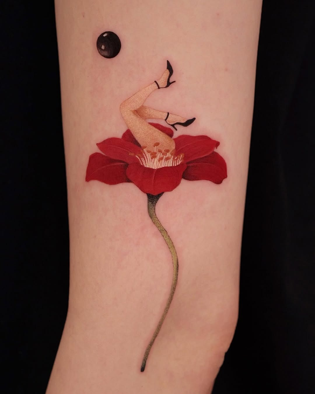 Intriguing blend of floral and human elements Tattoo Design