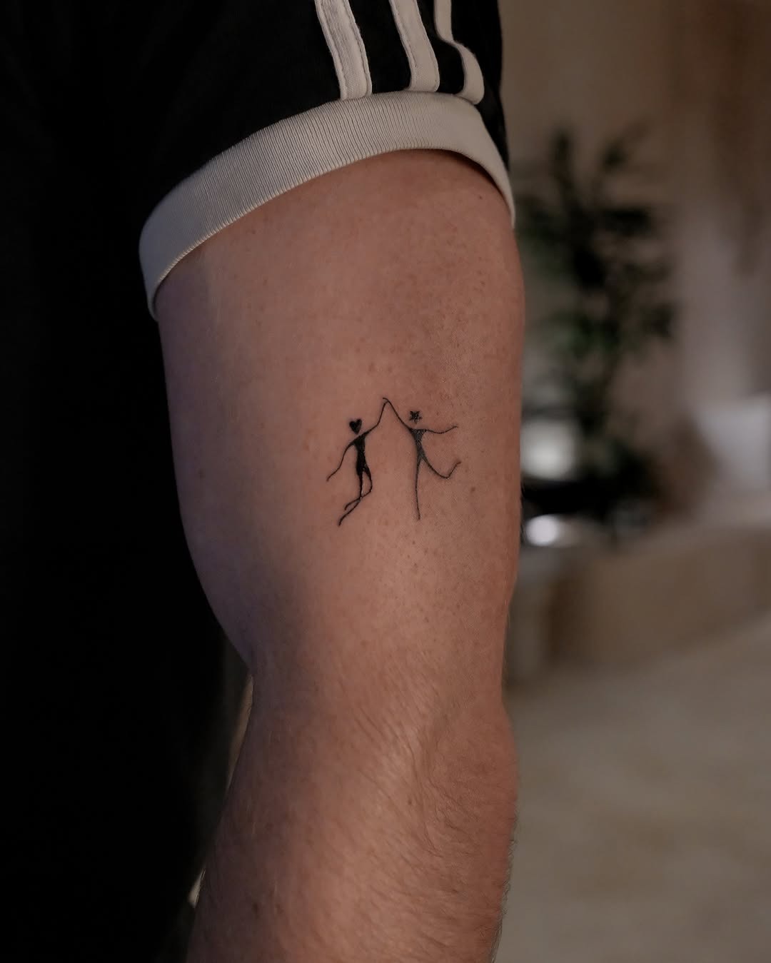 Two figures celebrate unity through dance tattoos. Tattoo Design