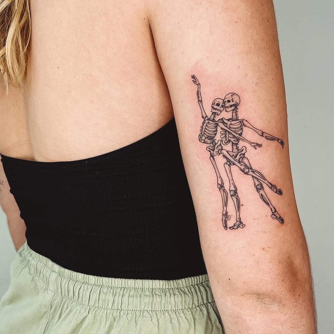 Unique Skeletons Celebrating Dance in Ink Tattoo Design
