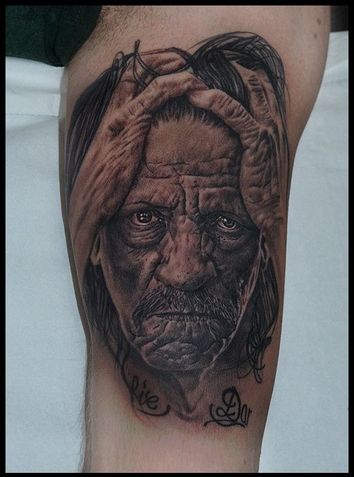 Nothing honors a legend like an intricately shaded portrait tattoo, and this particular piece takes realism to another level.