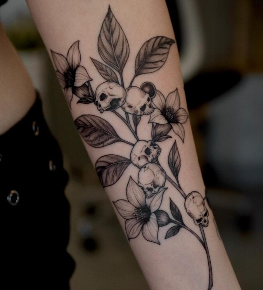 A hauntingly beautiful skull and flower tattoo Tattoo Design