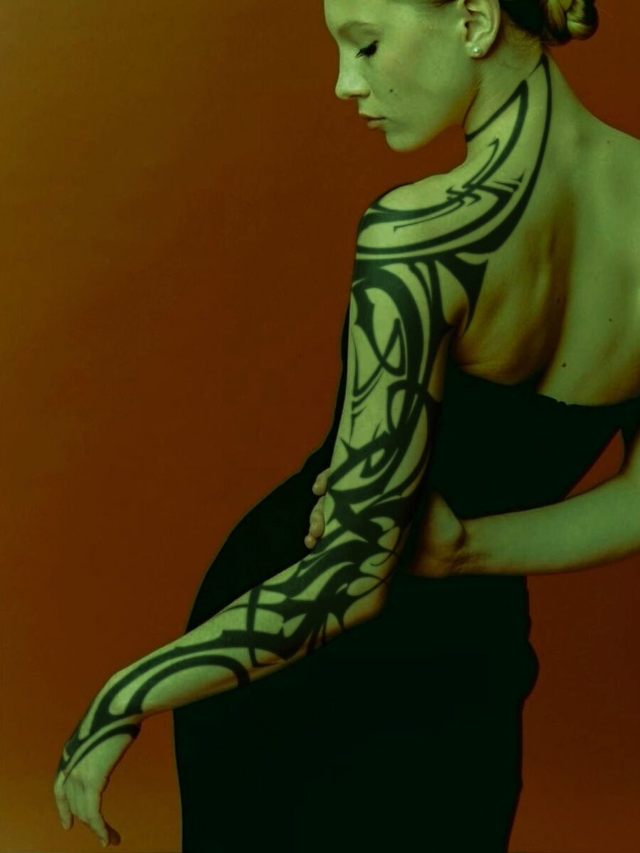 Captivating tribal design on elegant arm. Tattoo Design