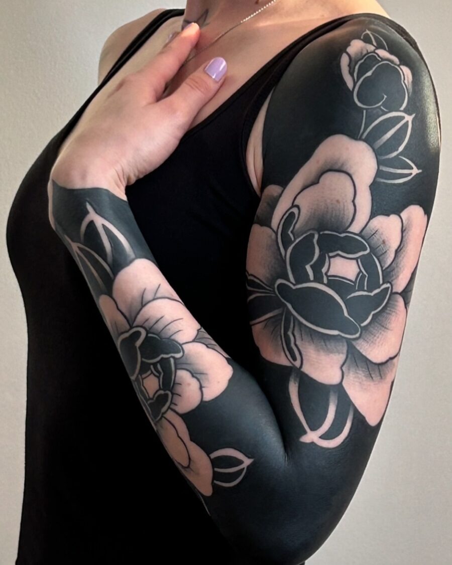 Elegant black and blush floral arm tattoo Tattoo Design