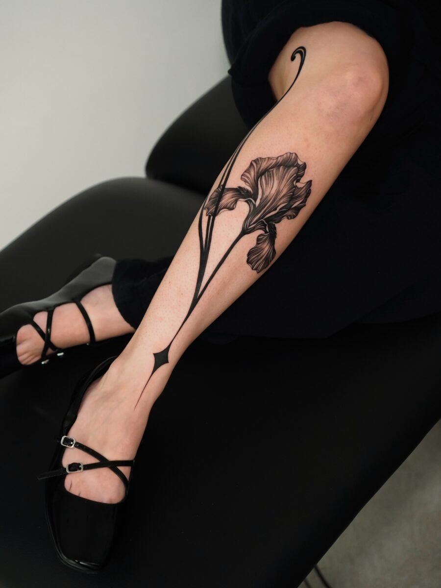 Elegant black floral tattoo on the leg Tattoo Design