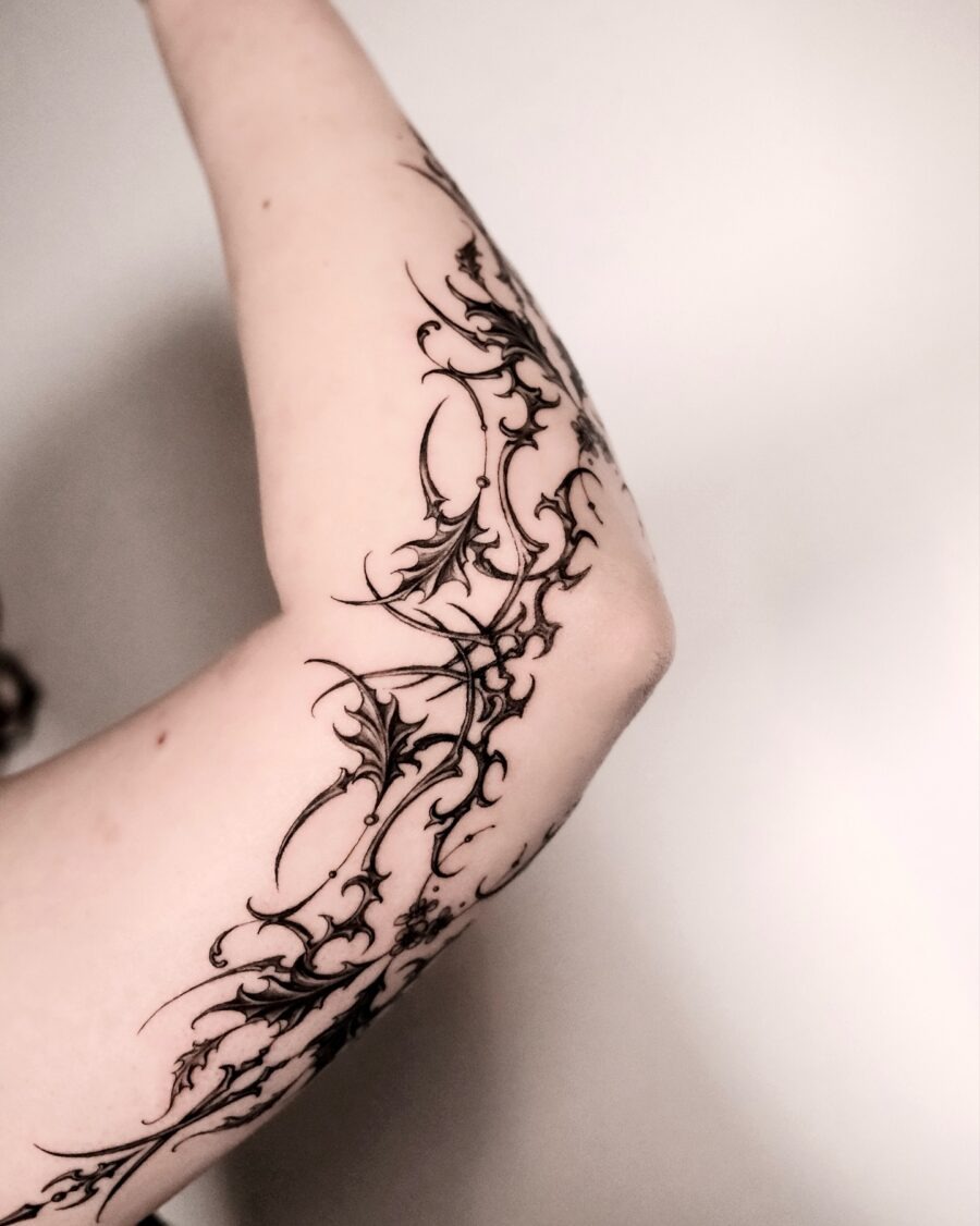 Intricate batwing floral arm tattoo design Tattoo Design