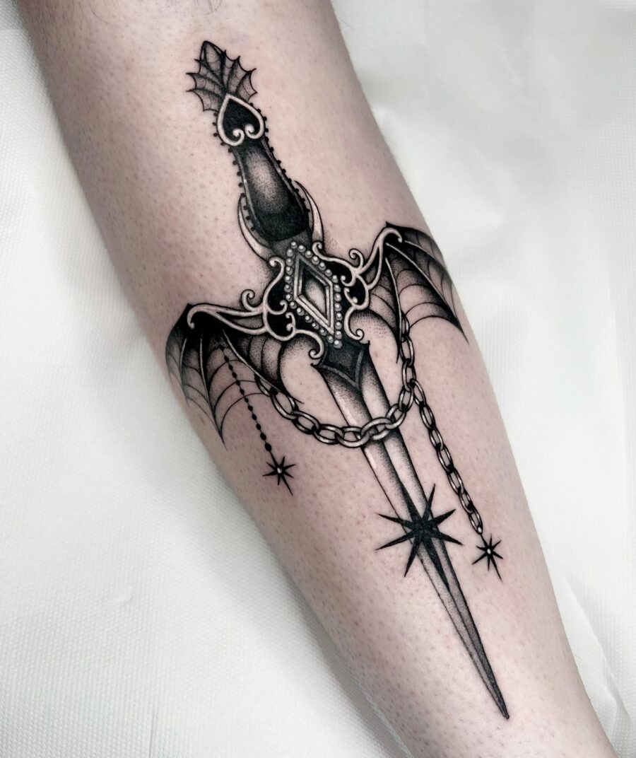 Intricate dagger tattoo with gothic elements Tattoo Design