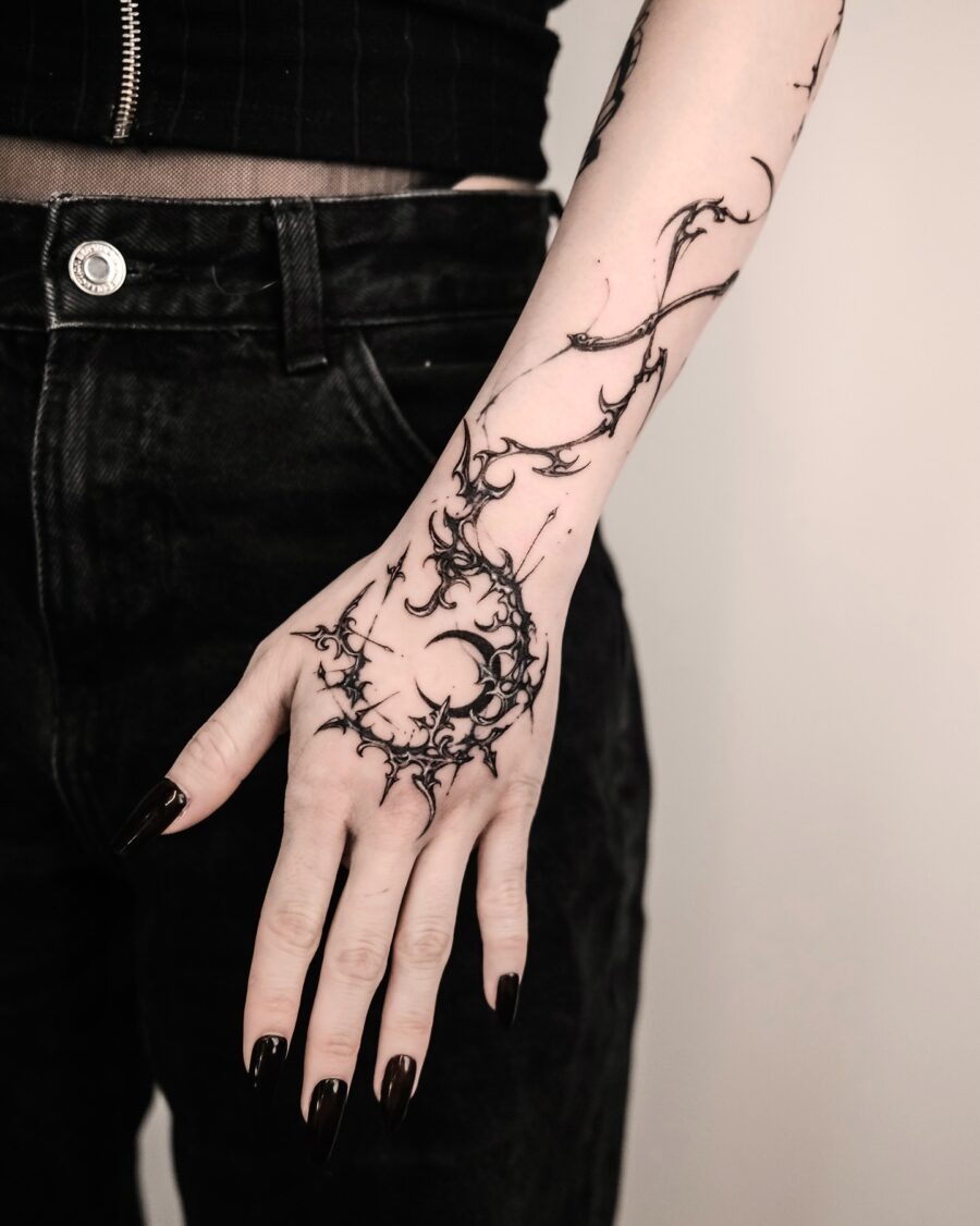 Intricate shadowy design adorns the hand Tattoo Design