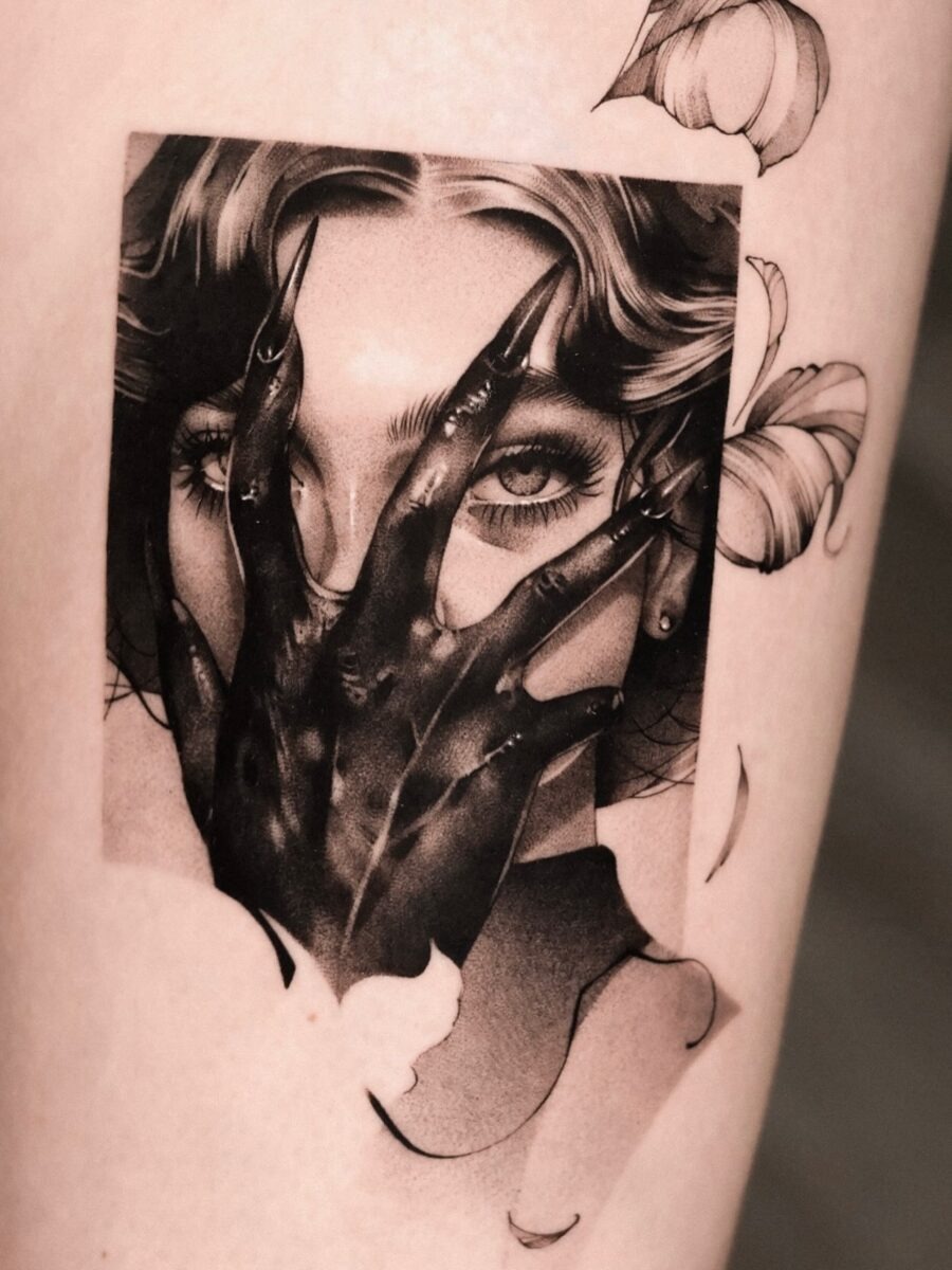 Mysterious dark feminine tattoo with haunting imagery Tattoo Design
