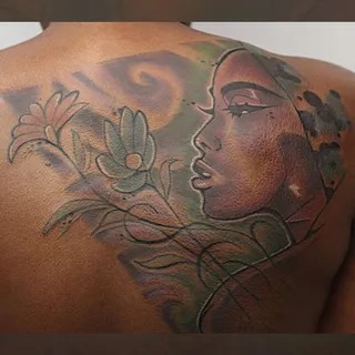 Dual-Faced Artistic Portrait on the Shoulder Tattoo Design