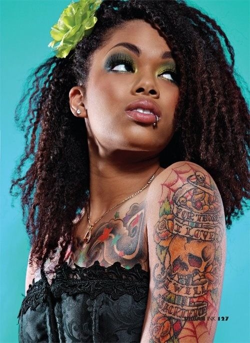 Vibrant Half-Sleeve Tattoo with Skulls and Hearts Tattoo Design